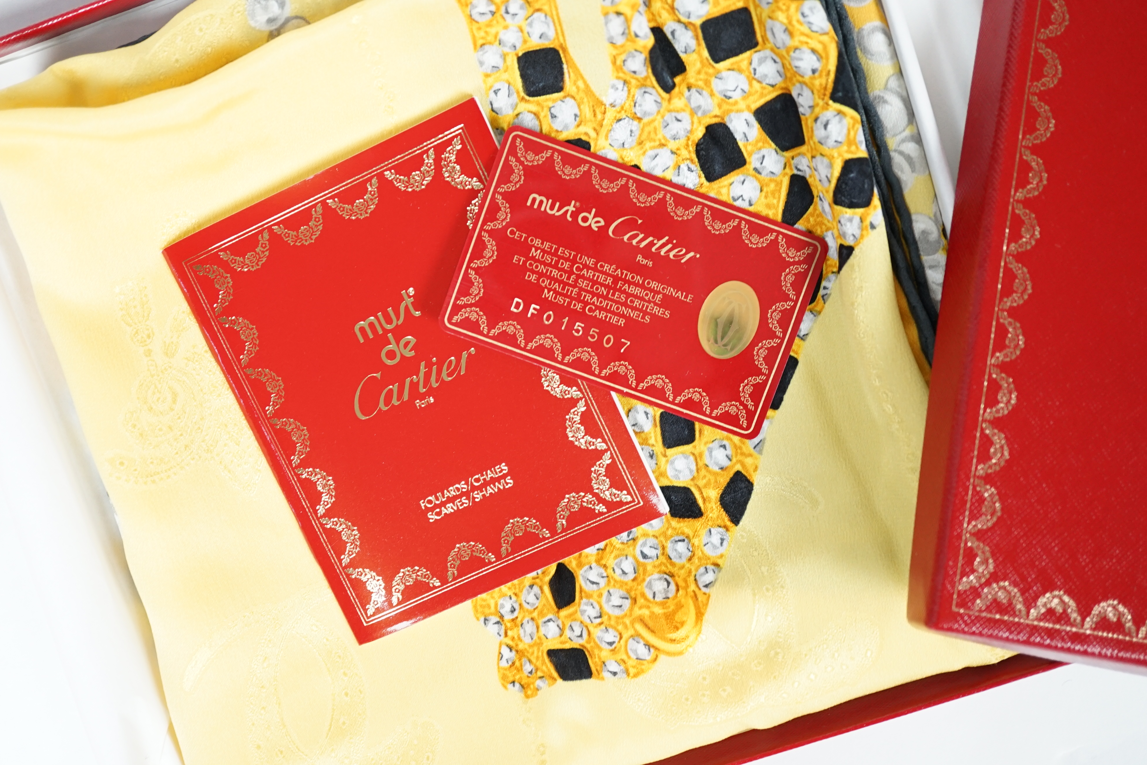 A Louis Vuitton, Cartier and Pucci boxed scarves